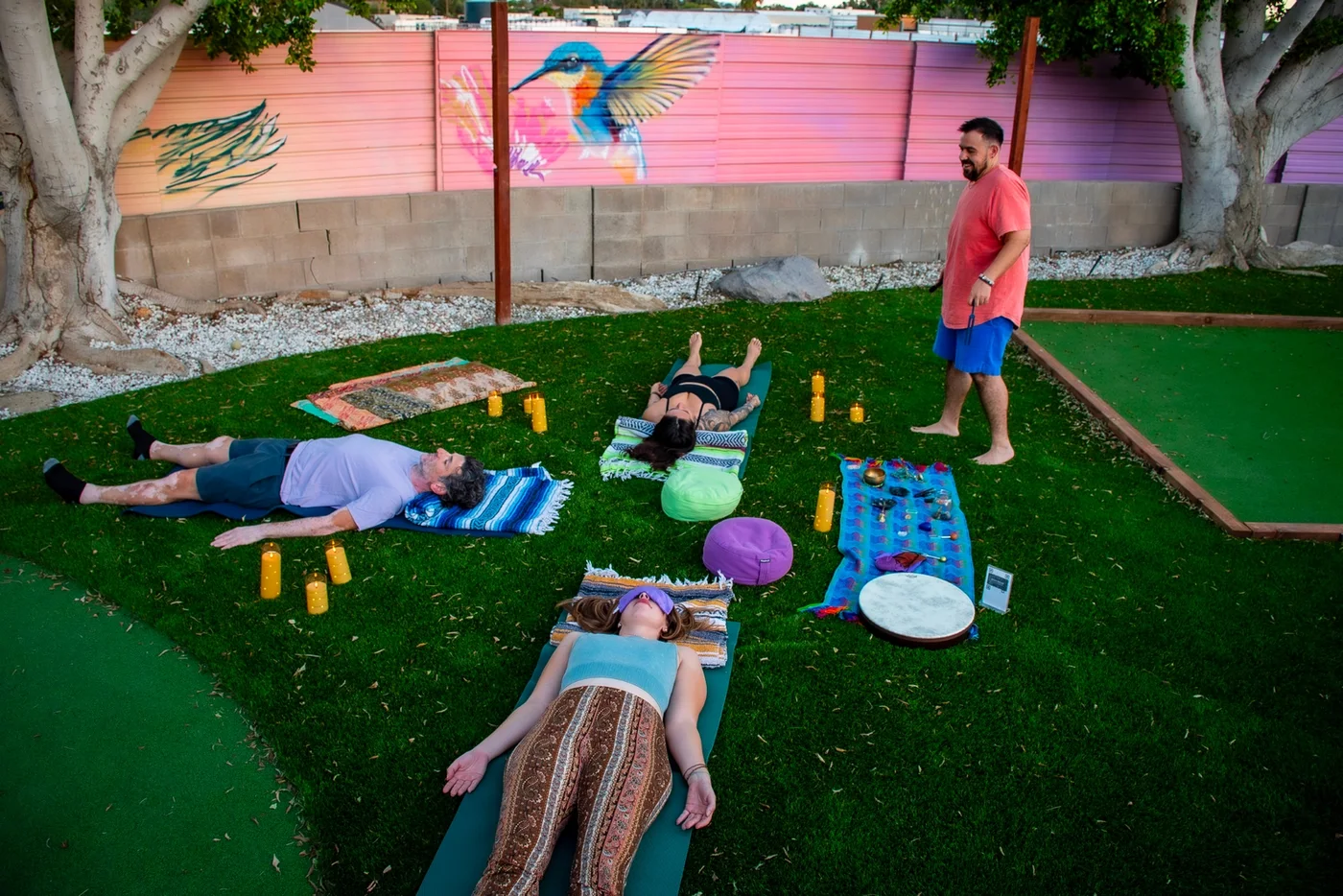 Participants resting during a desert sound bath at Casa Prana